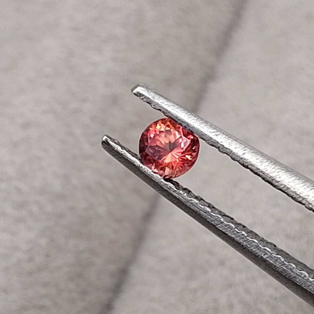 0.20 CT Natural Padparadscha Sapphire - Unheated_heldby_tweezer