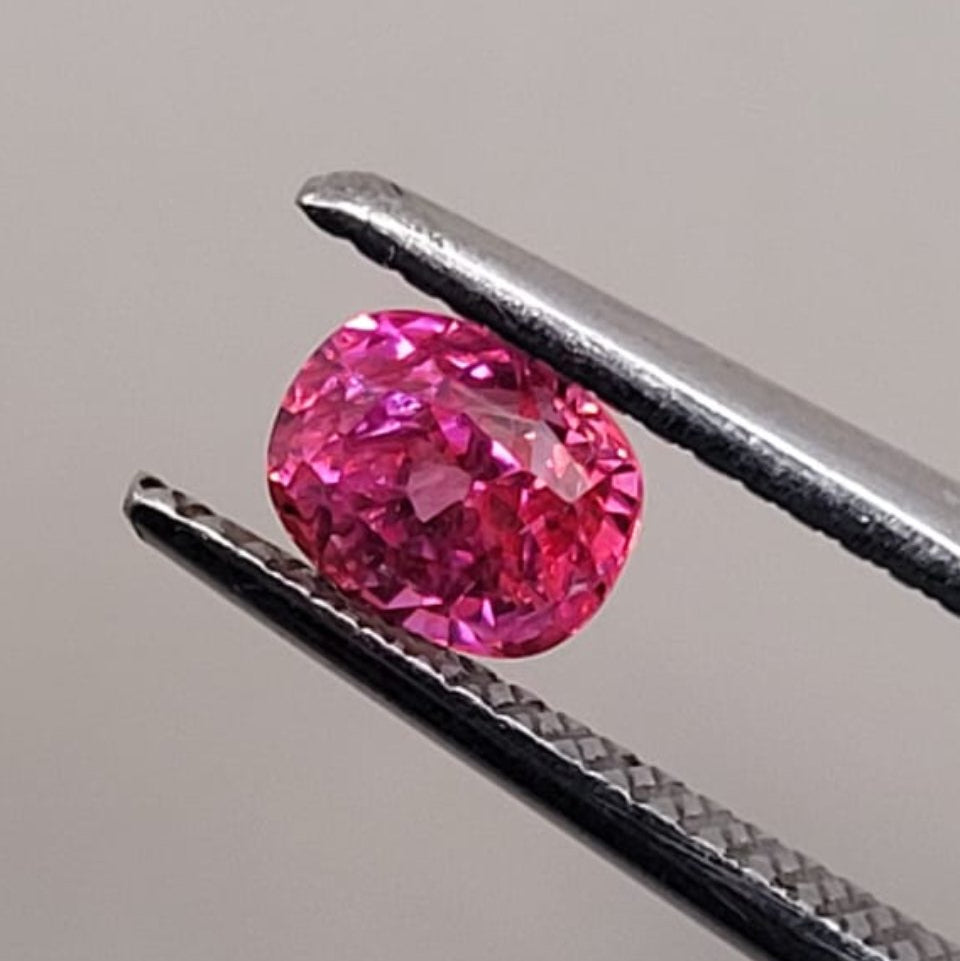 0.50 CT Natural Padparadscha Sapphire - Heated_heldby_tweezer