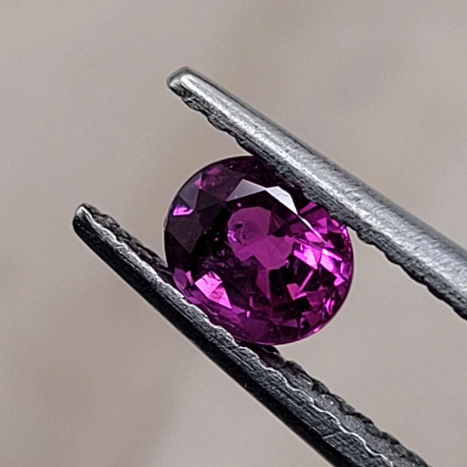 0.51 CT Natural Ruby - oval_Unheated_heldby_tweezer