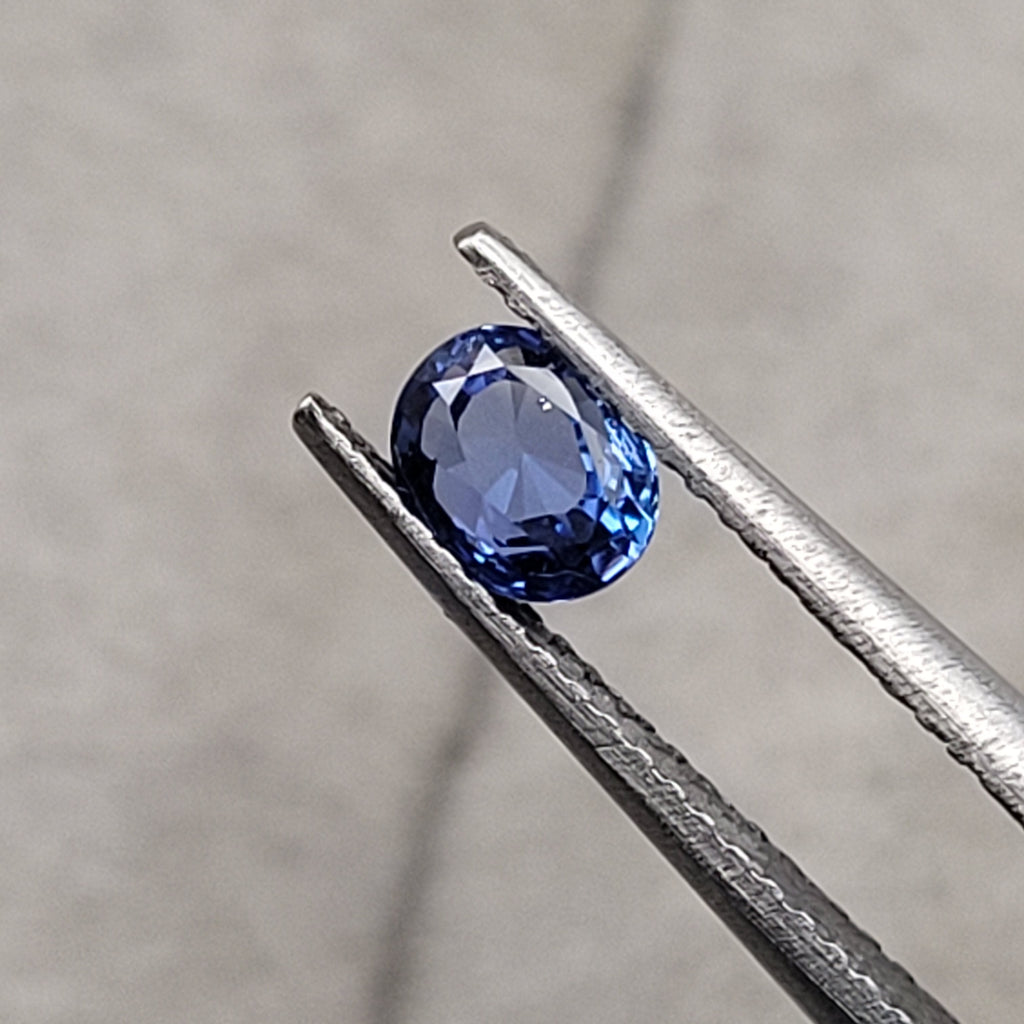 0.57 CT Natural Blue Sapphire - Unheated_heldby_tweezer