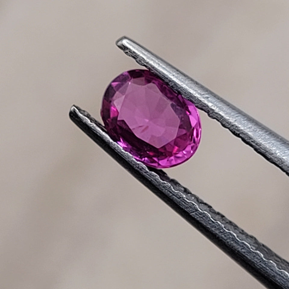 0.62 CT Natural Pink Sapphire - Unheated_heldby_tweezer