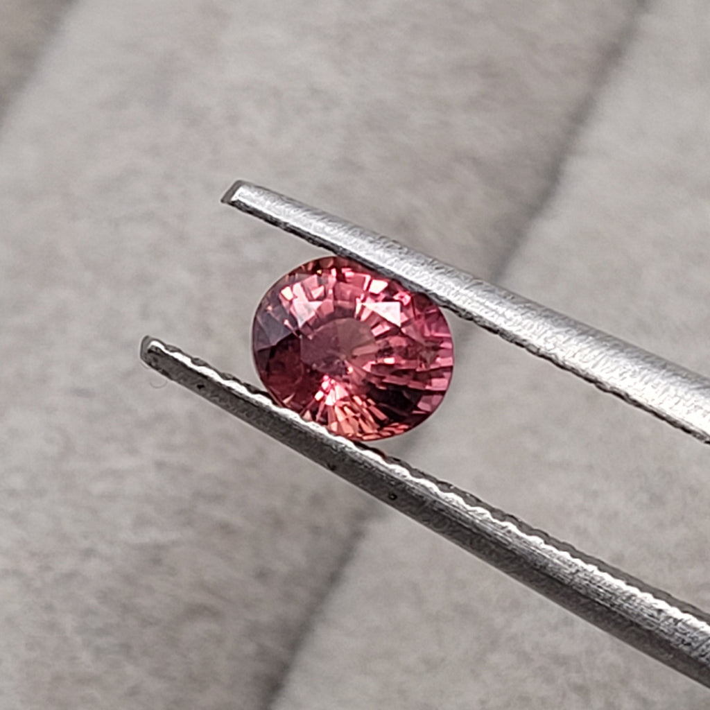 0.70 CT Natural Padparadscha Sapphire - Unheated_heldby_tweezer