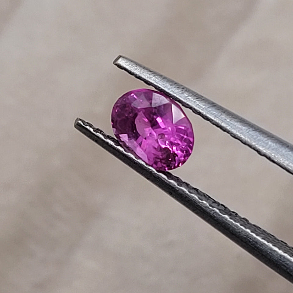 0.72 CT Natural Pink Sapphire - Unheated_heldby_tweezer