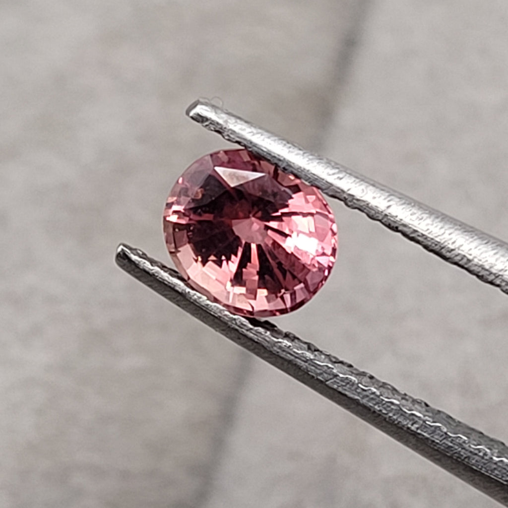 0.82 CT Natural Padparadscha Sapphire - Unheated_heldby_tweezer