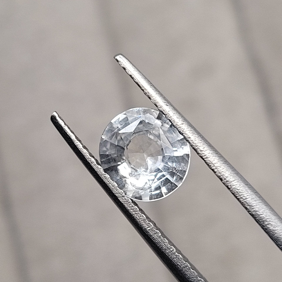1.25 CT Natural White Sapphire - Unheated_heldby_tweezer