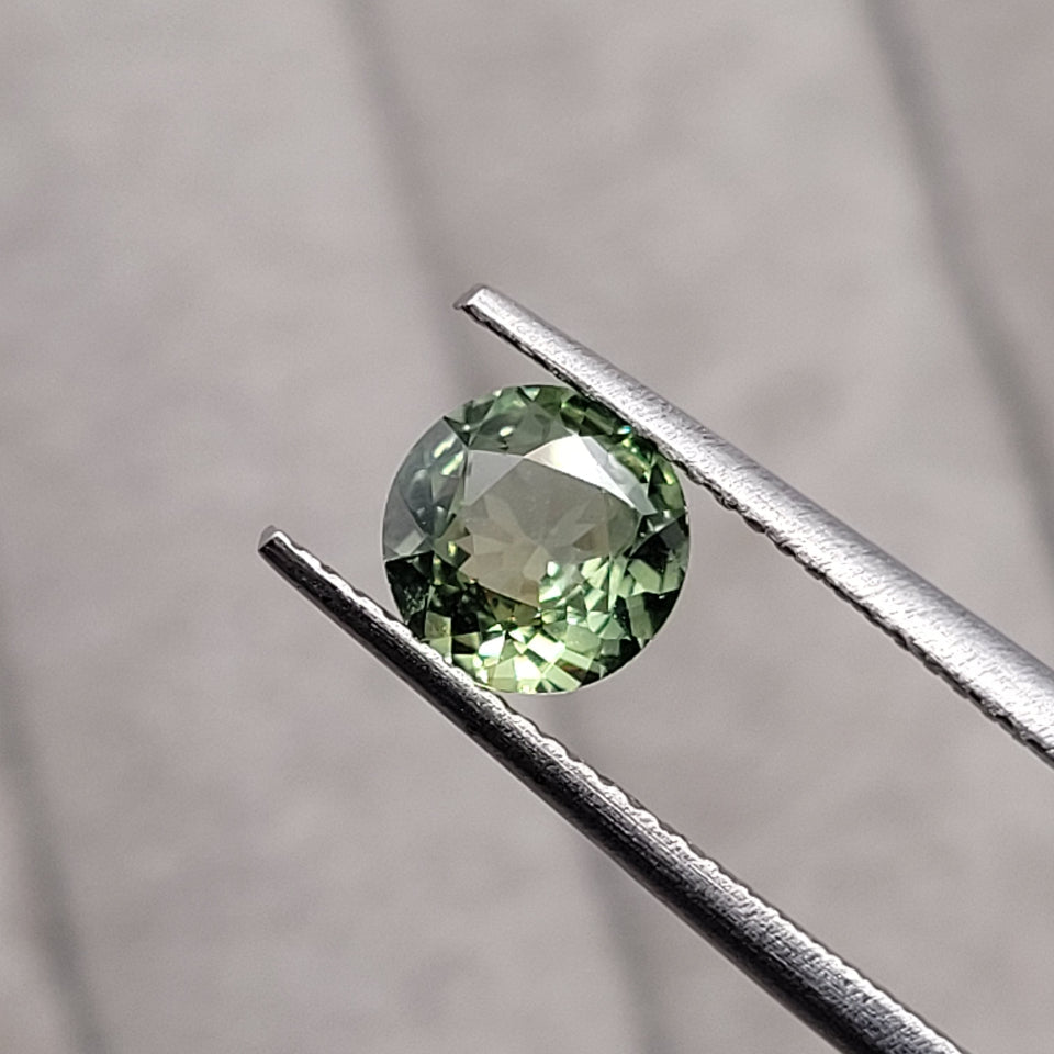 1.30 CT Natural Green Sapphire - Heated_heldby_tweezer