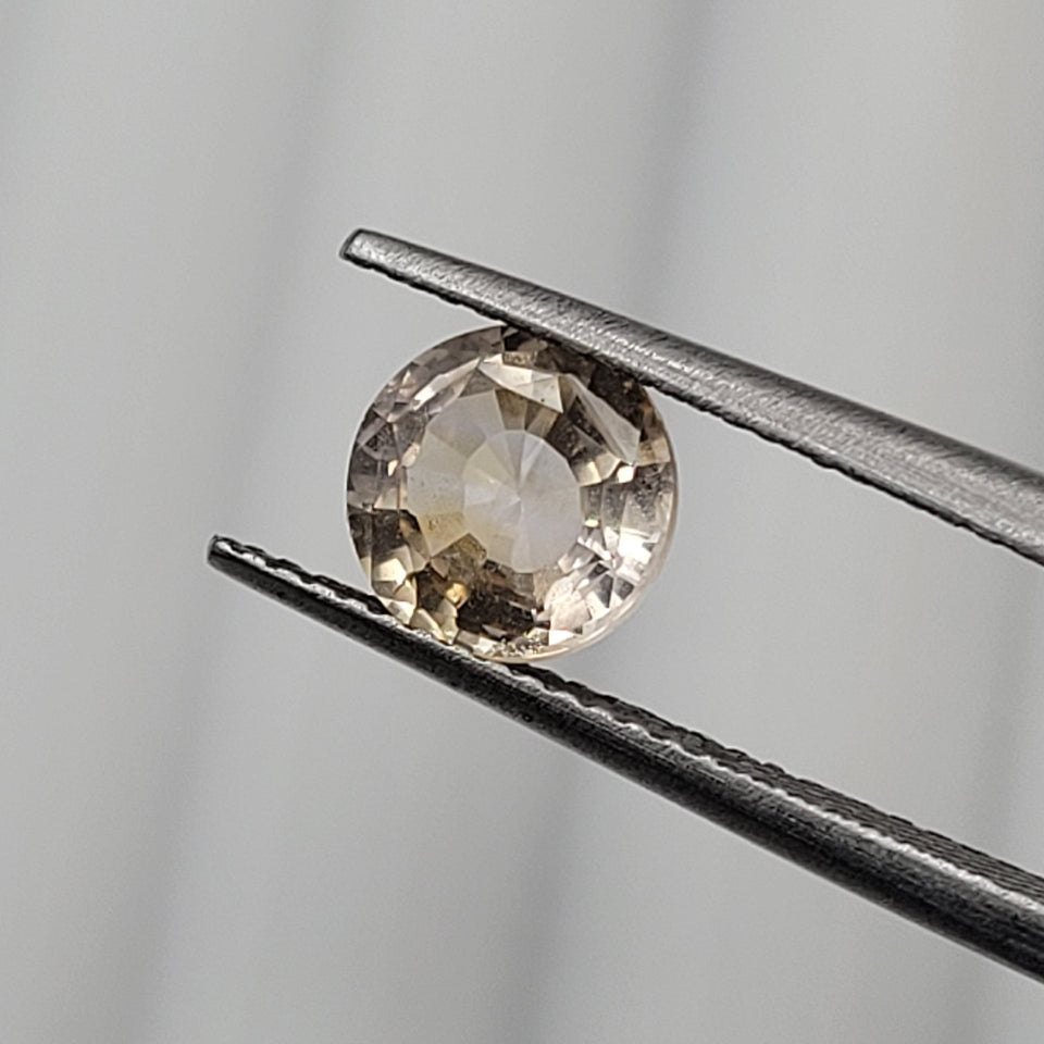 1.70 CT Natural Peach Sapphire - Unheated_heldby_tweezer